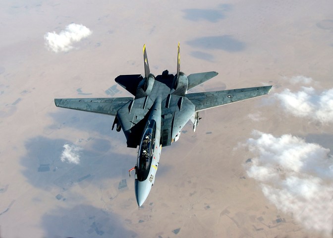 An F-14D Tomcat deploys its fuel probe prior to aerial refueling during a mission over the Persian Gulf Region. (US Navy/released)