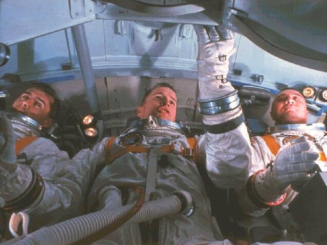 Astronauts for the first Apollo Mission (L-R) Roger B. Chaffee, Edward H. White and Virgil I. Grissom practice for the mission in the Apollo Mission Simulator. National Aeronautics and Space Administration - NASA Photo.