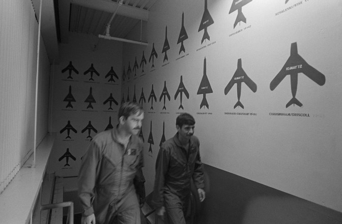 Red MiG silhouettes are painted on the walls at the Navy Fighter Weapons School to mark each victory by a Navy or Marine Corps air crew during the war in Southeast Asia. US Navy photograph.