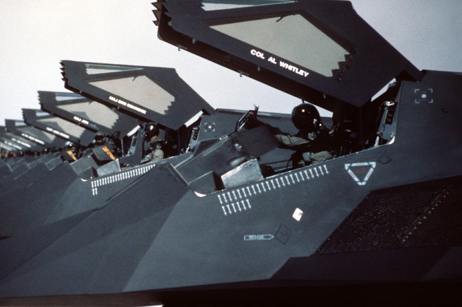  U.S. Air Force F-117 Nighthawks from the 37th Tactical Fighter Wing are lined up on the flight line at Nellis Air Force Base, Nevada, with canopies raised following their return from Saudi Arabia where they took part in Operation Desert Storm. (U.S. Air Force Photograph/Released)