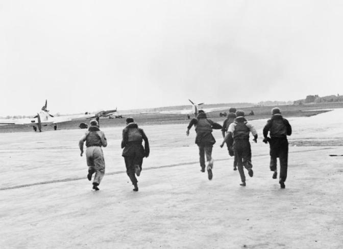 RAF pilots scrambling upon receiving reports of inbound Luftwaffe bomber aircraft.