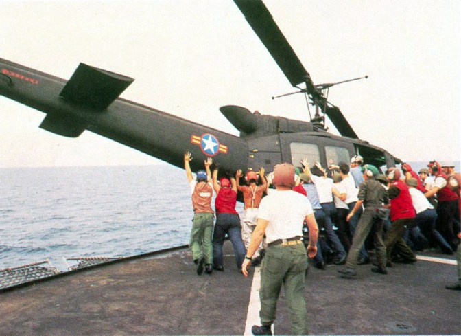 South Vietnamese UH-1H being pushed overboard to make room for a Cessna O-1 landing. Operation Frequent Wind, the final operation in Saigon, began April 29, 1975. During a nearly constant barrage of explosions, the Marines loaded American and Vietnamese civilians, who feared for their lives, onto helicopters that brought them to waiting aircraft carriers. The Navy vessels brought them to the Philippines and eventually to Camp Pendleton, Calif. (U.S. Navy/released)