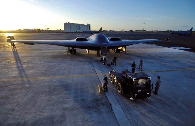 A B-2 Spirit is towed to a parking spot at Hickam Air Force Base, Hawaii. The LRS-B will likely serve as a supplement to the US Air Force's B-2 and B-1B fleet while gradually replacing the mainstay B-52, which has been in service since the late 1950s. (U.S. Air Force photo/Tech. Sgt. Shane A. Cuomo)