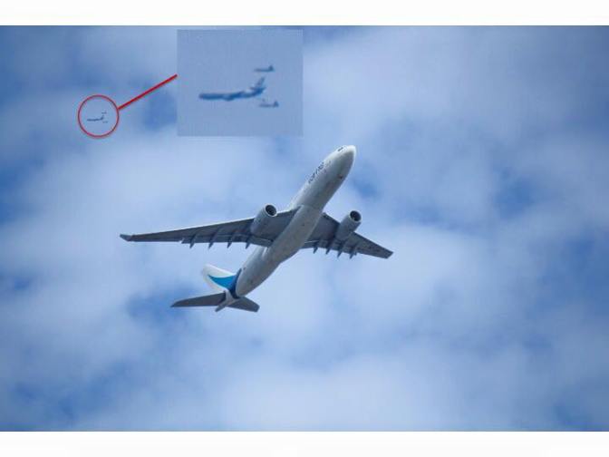 A pair of F-22 Raptors caught tanking up with a KC-10 Extender over New York last week by photographer Robert Dube, who was out planespotting near Queens, New York City. Dube, at first, thought that the lens of his camera was dirty, but upon further inspection of the image, noticed that he fortuitously caught the Raptors receiving gas from the KC-10.